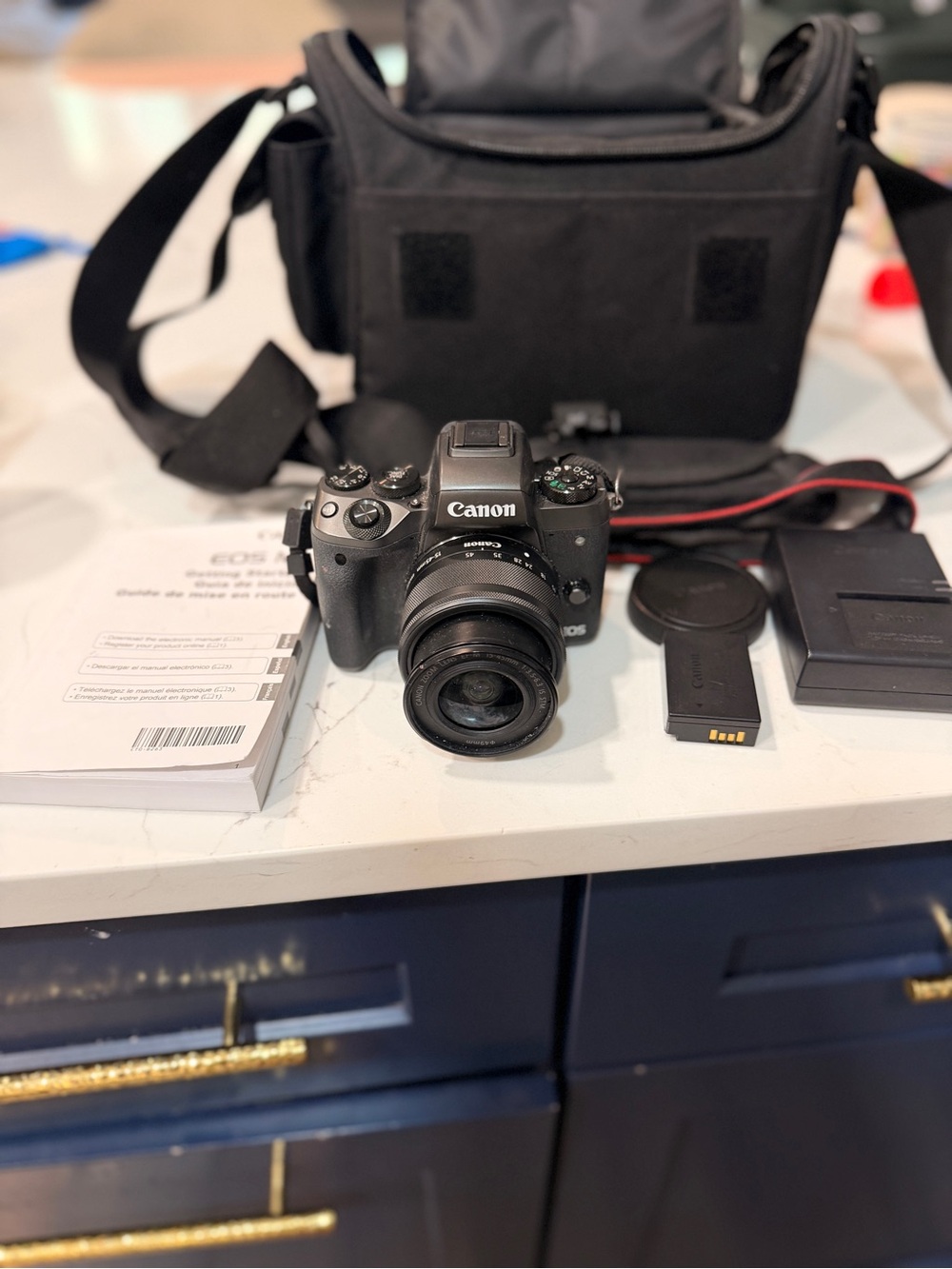 Canon Black Mirrorless Camera with Black Lens and Accessories